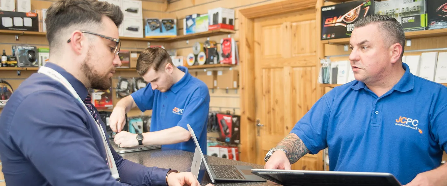 JCPC team helping a customer in the Worksop repair shop